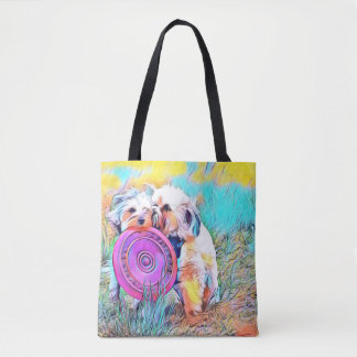 Two cute dogs playing frisbee tote