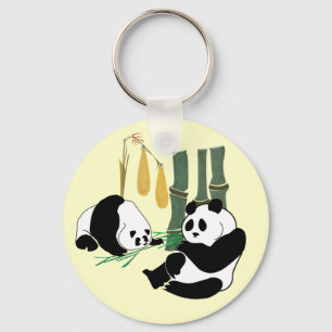 Two Cute Pandas eat bamboo in tropical forest Keychain