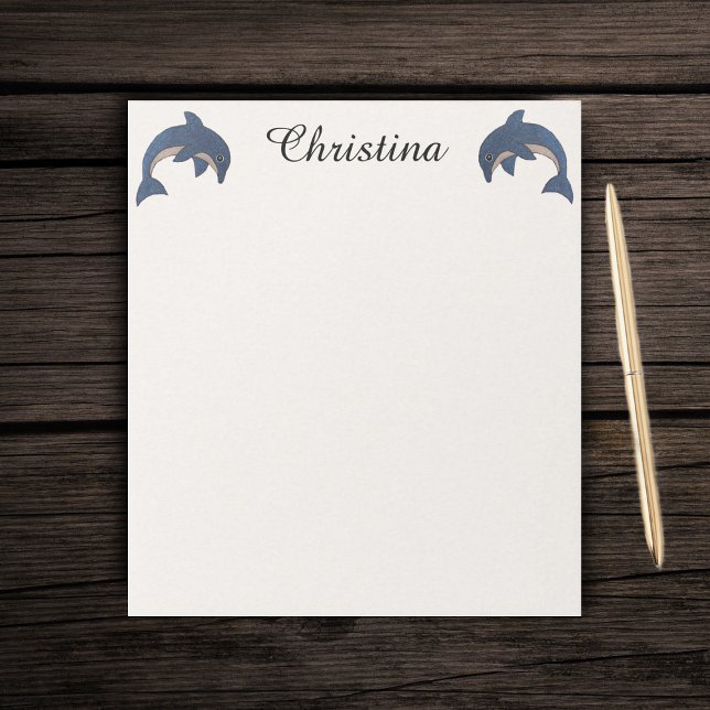 Two Cute Sparkle Like Dolphins Jumping Dark Blue Notepad (Two blue sparkling jumping dolphins on textured look white paper notepad.)
