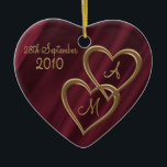 Two entwined gold hearts ceramic ornament<br><div class="desc">Two interlocked metal effect golden hearts with matching shaded initials and date of occasion, especially for the one you love on your wedding anniversary or Valentine's day. The metallic hearts are on a background of deep crimson satin or silk effect shading. Please note, these are printed shading effects, not fabric...</div>