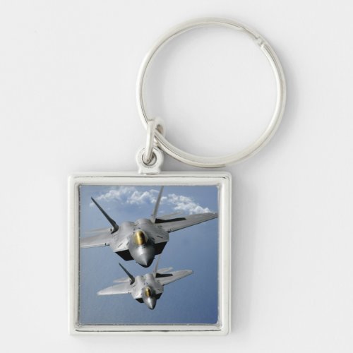 Two F_22 Raptors fly over the Pacific Ocean Keychain