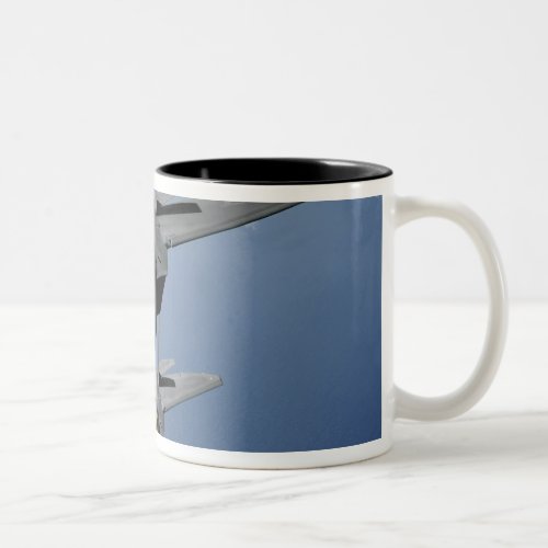 Two F_22 Raptors fly over the Pacific Ocean Two_Tone Coffee Mug