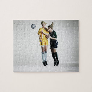 Two female soccer players in mid air heading jigsaw puzzle