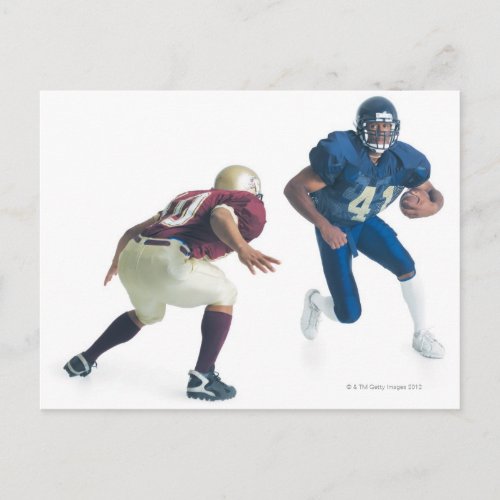 two football players from opposing teams are postcard