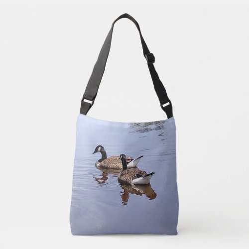 Two Geese Swimming Together in the Calm Lake Crossbody Bag