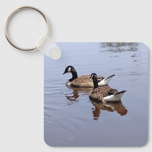 Two Geese Swimming Together in the Calm Lake Keychain