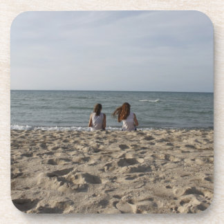 Two Girls on Sandy Beach: 2 Girls Face Windy Ocean Drink Coaster
