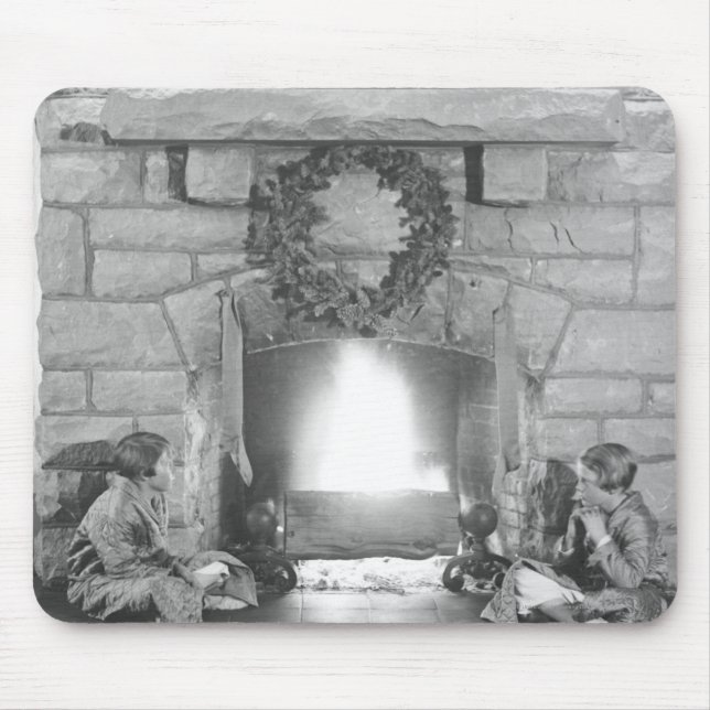 Two girls sitting by a fireplace at Christmas Mouse Pad (Front)
