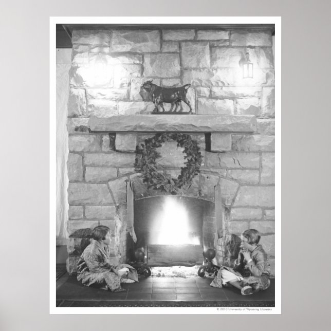 Two girls sitting by a fireplace at Christmas Poster (Front)