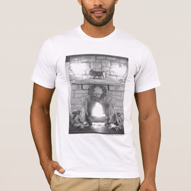 Two girls sitting by a fireplace at Christmas T-Shirt (Front)