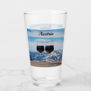 Two glasses of red wine against mountains