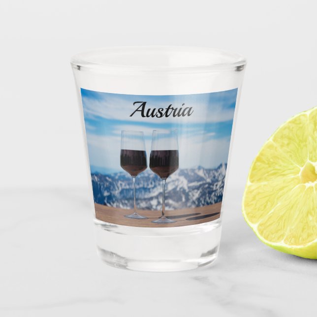 Two glasses of red wine against mountains (Front)