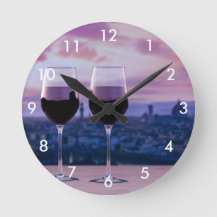 Two glasses of red wine on Florence skyline Round Clock