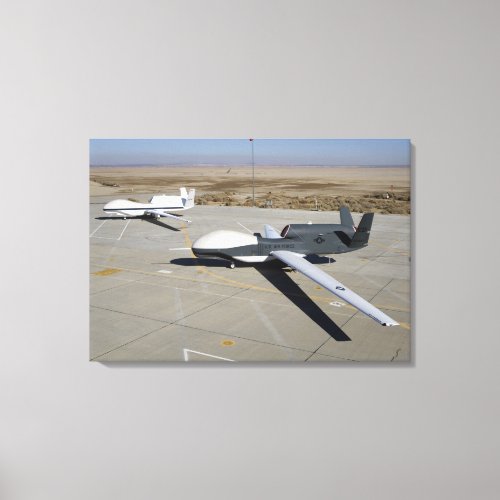Two Global Hawks parked on a ramp Canvas Print