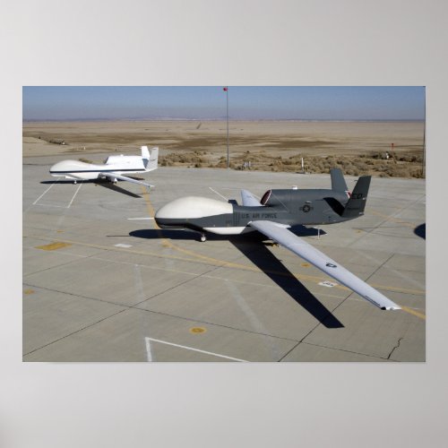 Two Global Hawks parked on a ramp Poster