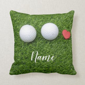 Two Golf balls and love heart are on green grass Throw Pillow
