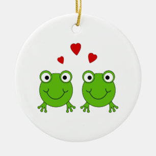 Two green frogs with red hearts. ceramic ornament