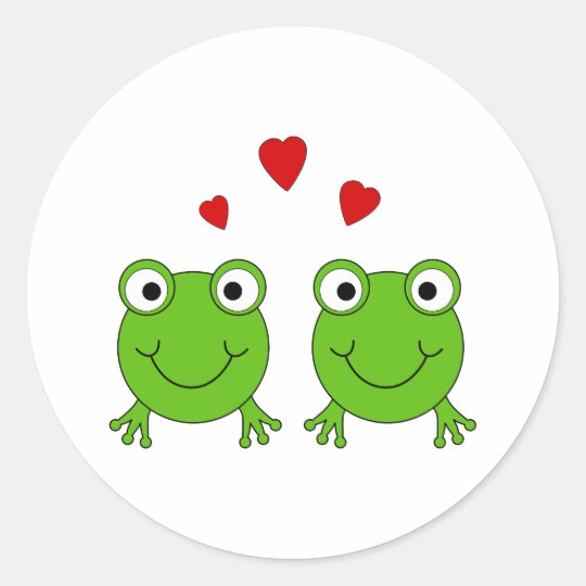 Two green frogs with red hearts. classic round sticker