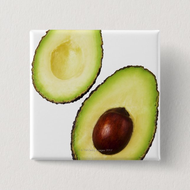 Two halves of an an avocado, on white pinback button (Front)