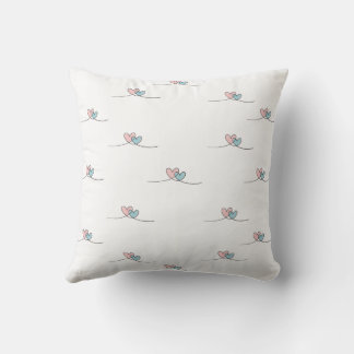 Two hearts with wings, one red and one blue throw pillow