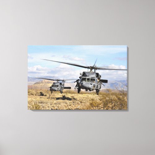 Two HH_60 Pavehawk helicopters preparing to lan Canvas Print