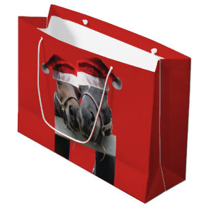 Two Horses Kissing with Santa Claus Hats on Large Gift Bag