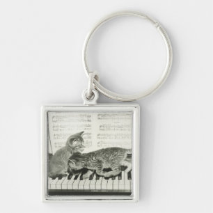Two kitten playing on piano keyboard, (B&W) Keychain