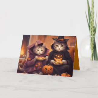 Two kittens in Halloween costumes with treats Card