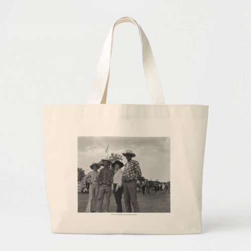 Two men and two women at a rodeo large tote bag