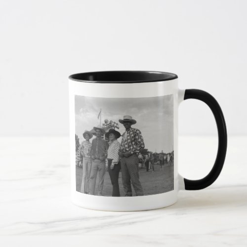 Two men and two women at a rodeo mug