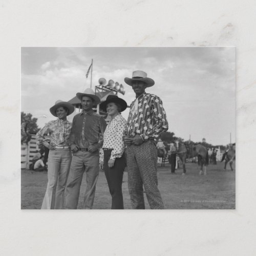 Two men and two women at a rodeo postcard