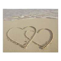 Two overlying hearts drawn on the beach