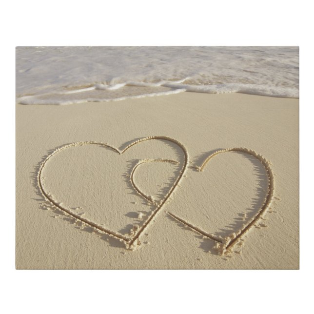 Two overlying hearts drawn on the beach faux canvas print (Front)