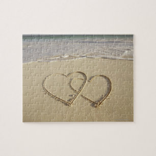 Two overlying hearts drawn on the beach jigsaw puzzle