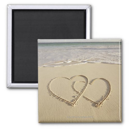 Two overlying hearts drawn on the beach magnet