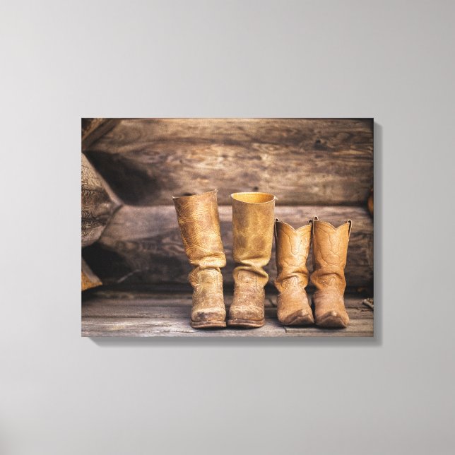 Two Pair Worn Cowboy Boots in Cabin Canvas Print (Front)