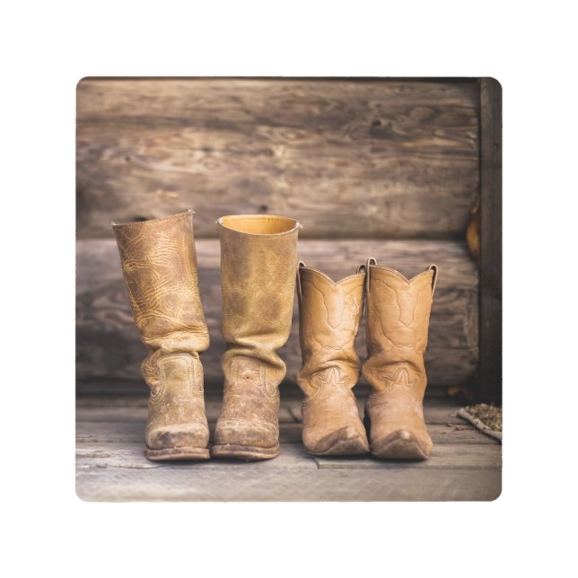 Two Pair Worn Cowboy Boots in Cabin Metal Print (Front)