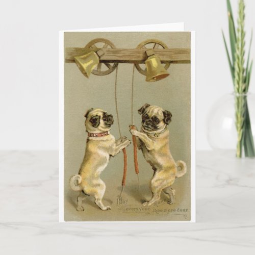 Two pug dogs ring the Christmas bells Holiday Card
