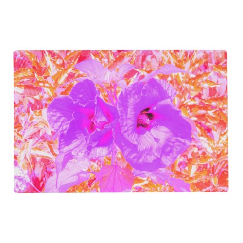 Two Purple and Hot Pink Plum Crazy Hibiscus on Red Placemat