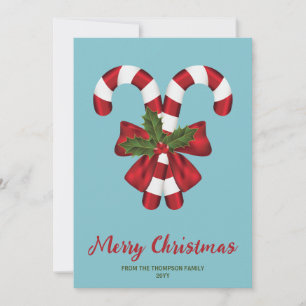 Two Red And White Candy Canes On Blue With Text Holiday Card