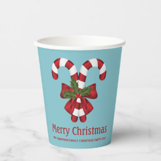 Two Red And White Candy Canes On Blue With Text Paper Cups