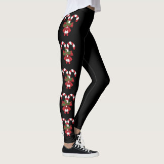Two Red And White Festive Candy Canes On Black Leggings
