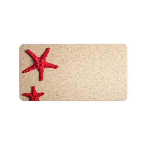 Two Red Starfish On Beach Background Label