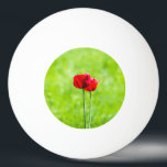Two red tulip flowers ping pong ball<br><div class="desc">Two red tulips against the green background and some yellow wildflowers. Textured photography.</div>