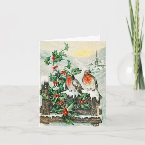 Two robins on a fence in the snow card