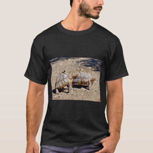 Two sulcata tortoises walking on ground T_Shirt