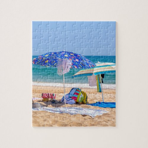 Two sun umbrellas and beach supplies at seaJPG Jigsaw Puzzle