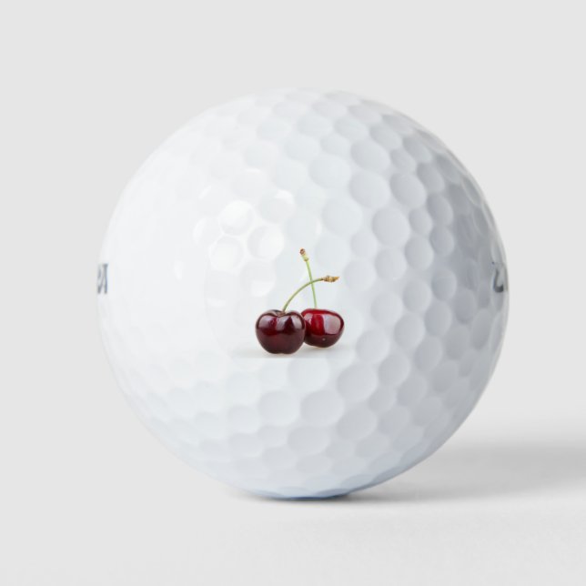 Two sweet cherry fruits isolated on white backgrou golf balls (Front)