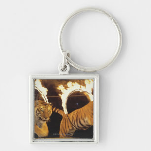 Two tigers leaping through burning rings of fire keychain