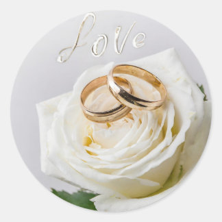 Two wedding rings on a white rose  classic round sticker